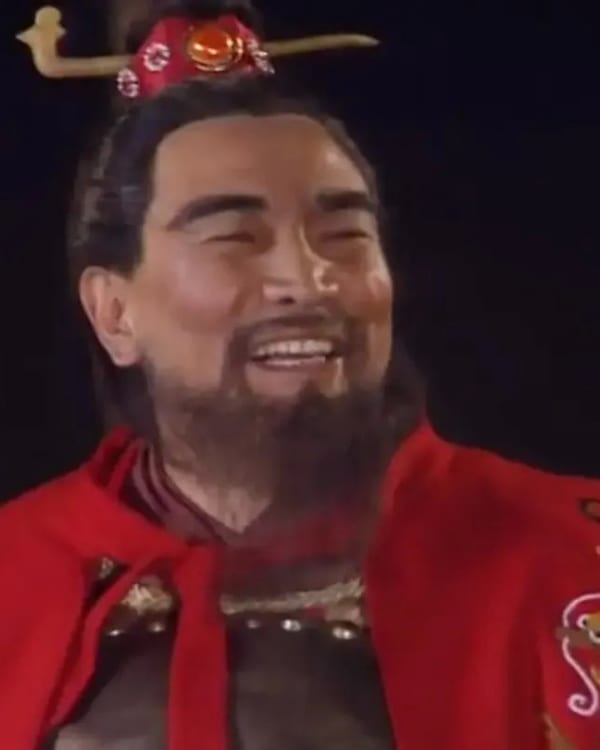 Bao Guo'an as Cao Cao, laughing